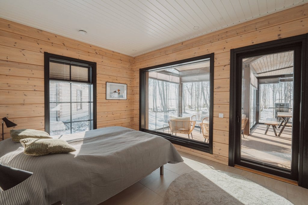 Bedroom with windows onto a glazed terrace