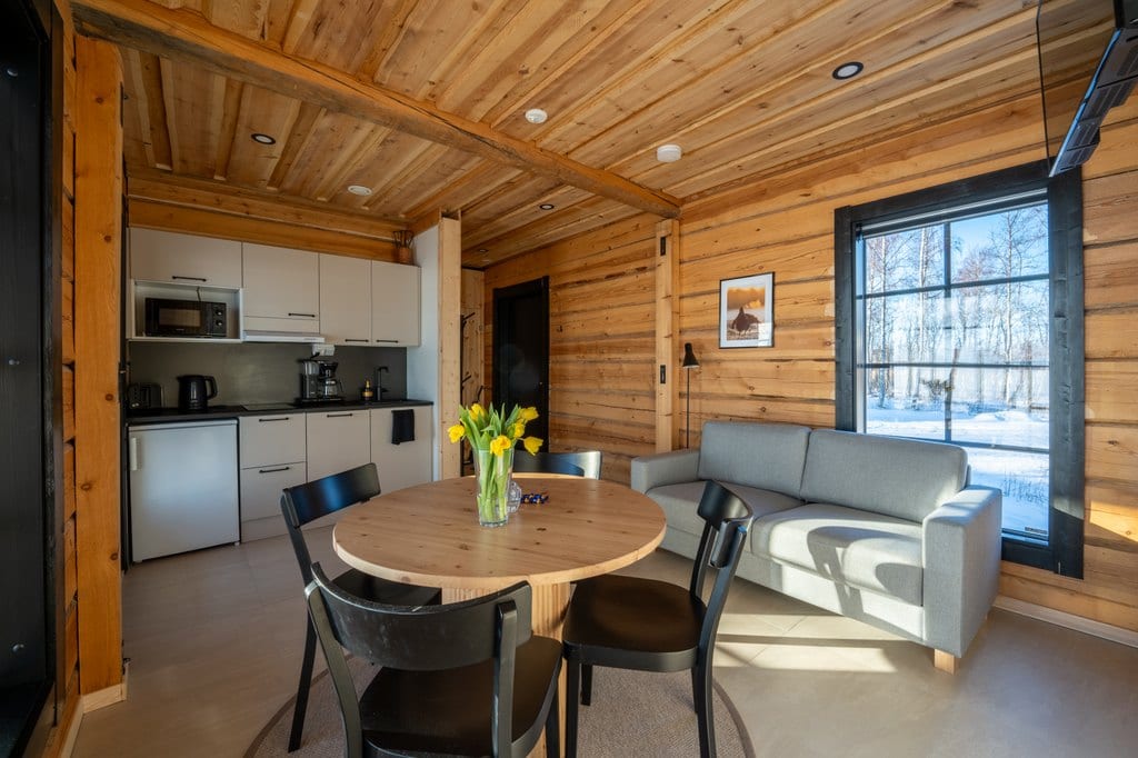 Uitto kitchen with a round table and gray sofa