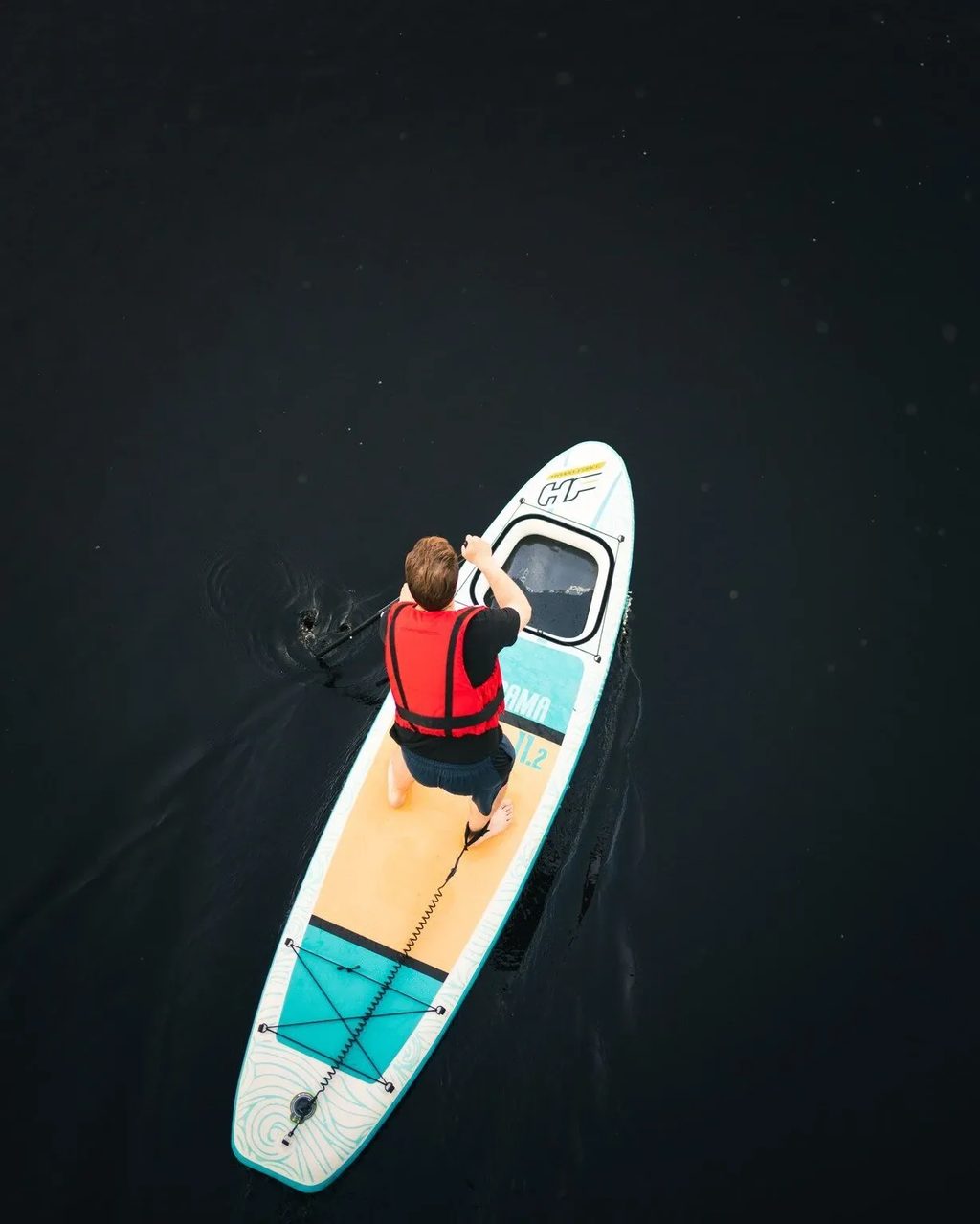 A paddleboarder seen from above