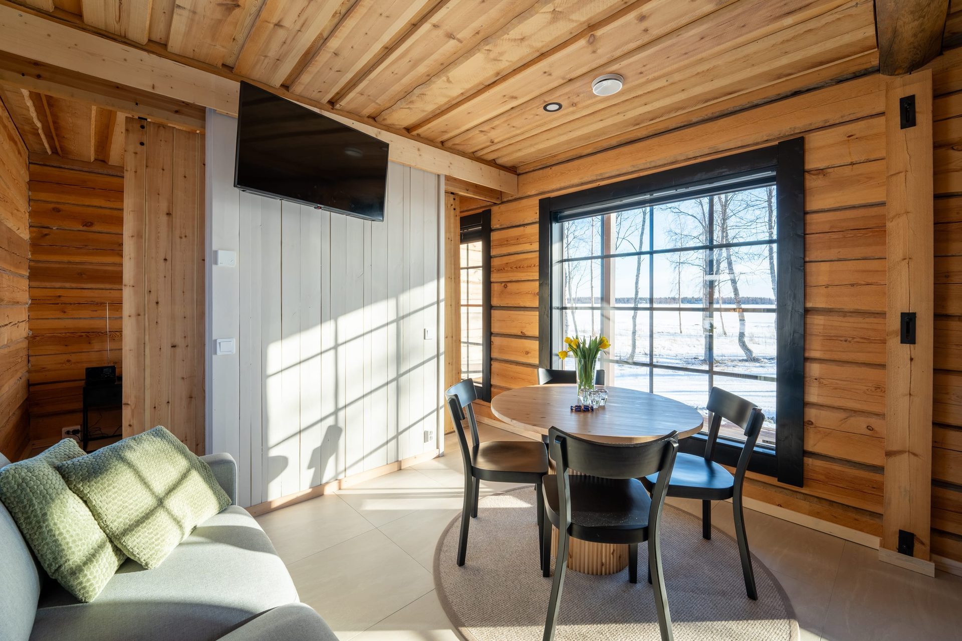 Uitto living room and dining table by a window