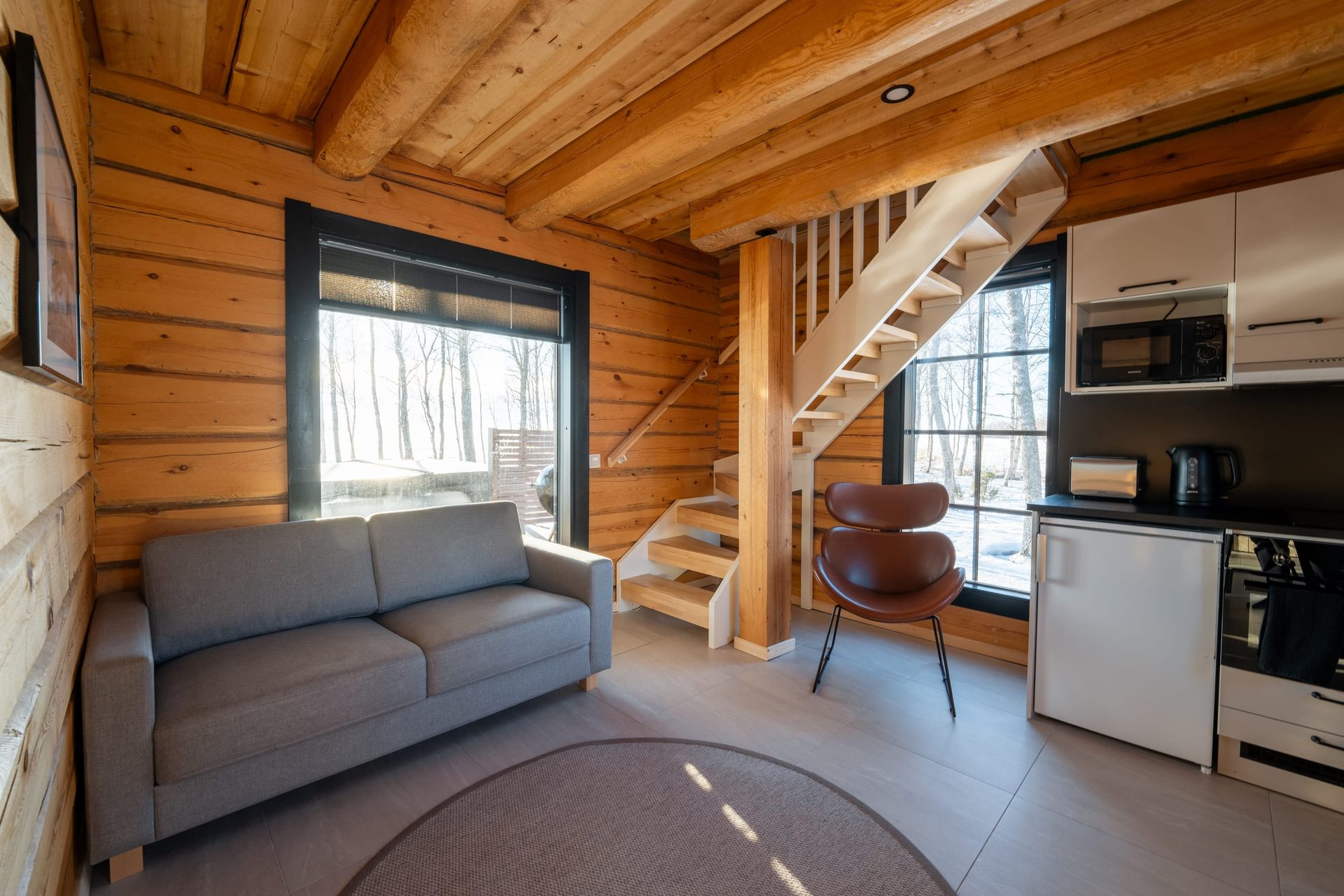 Usva living room, stairs to the loft and kitchenette