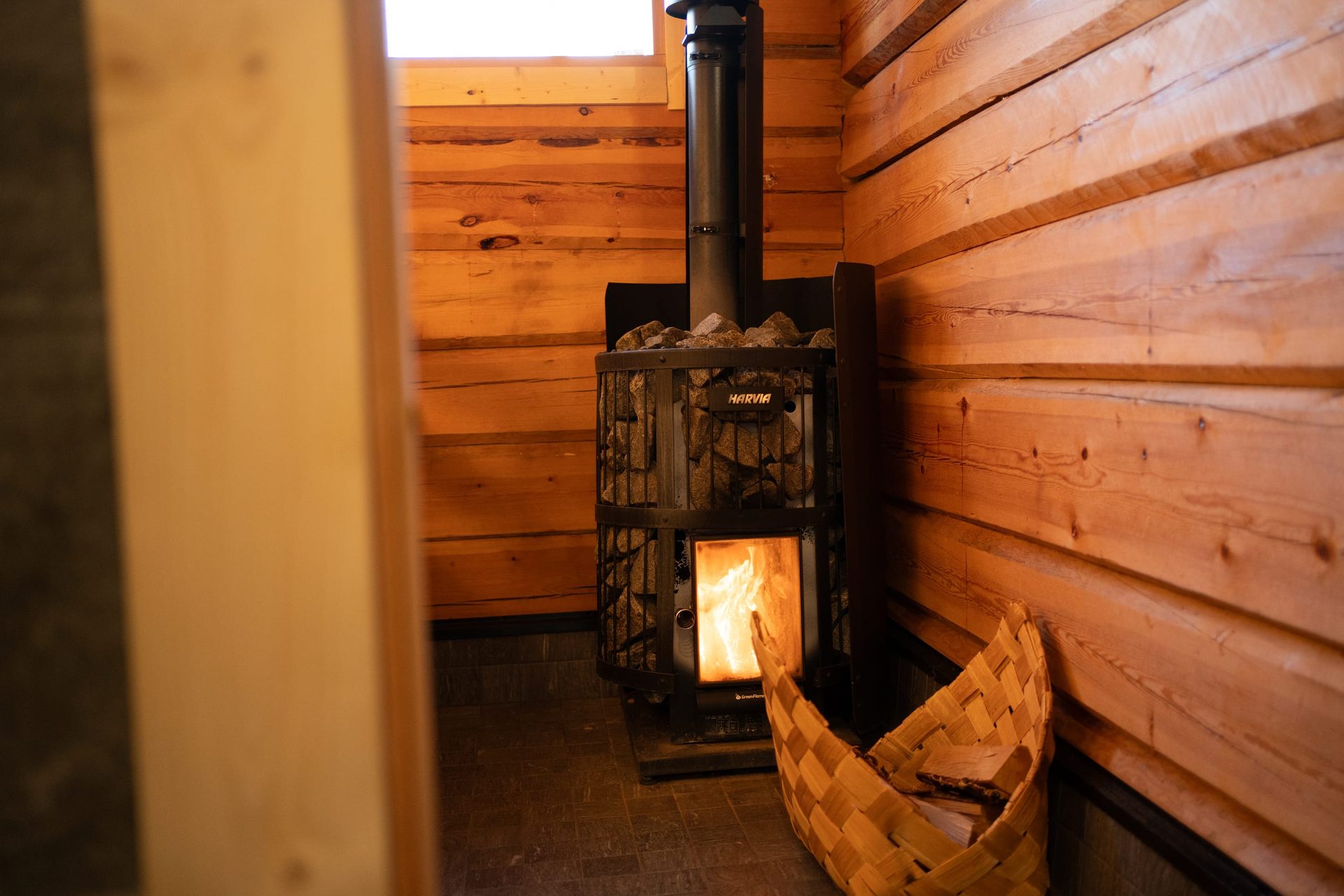 Usva sauna wood-burning stove and a wood-chip basket