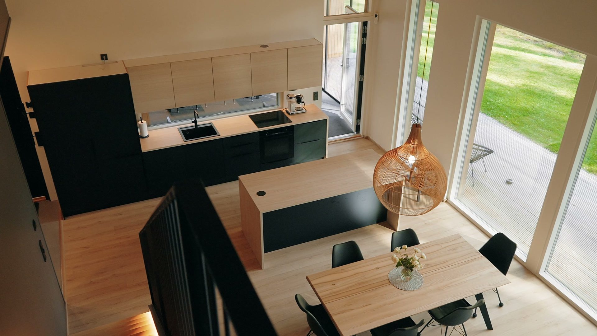 View from upstairs down to the kitchen and dining table
