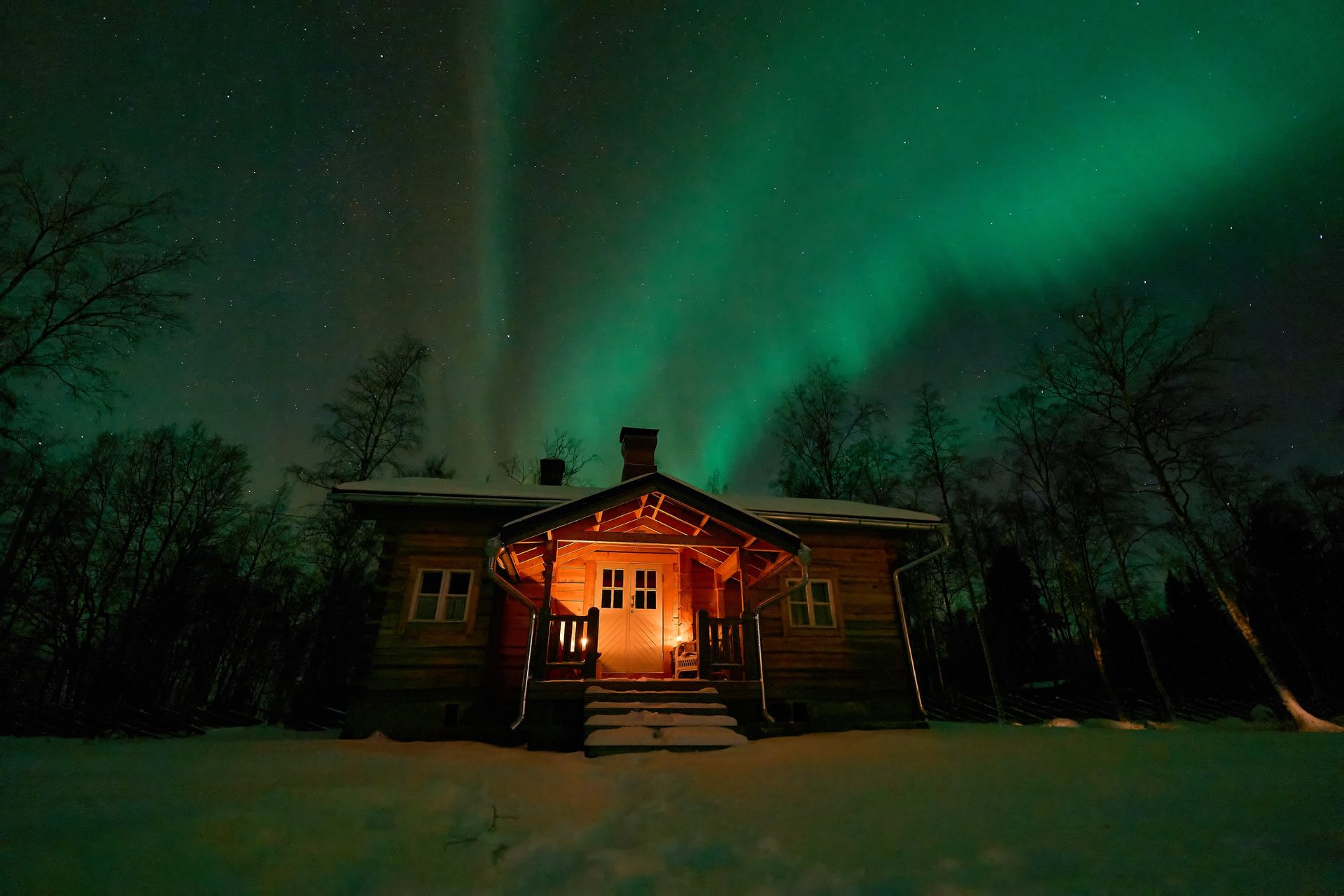 Log cabin under the northern lights